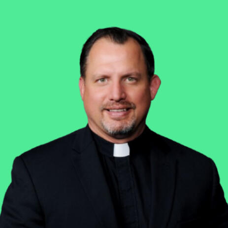 Headshot of a priest.